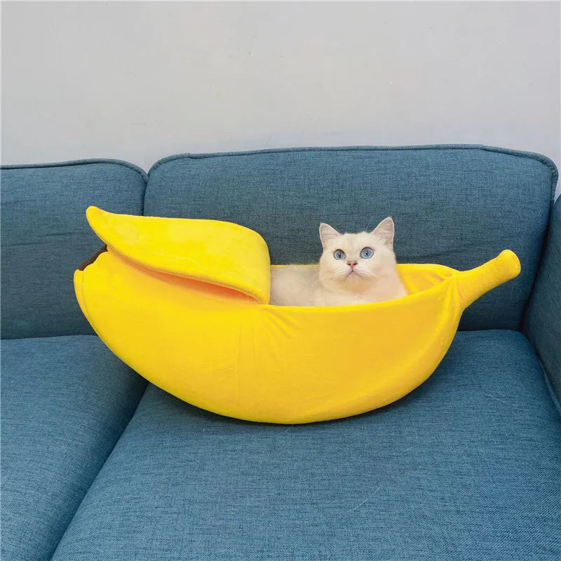 Banana-shaped cozy pet bedding for cats and small dogs, featuring a playful design and soft materials.