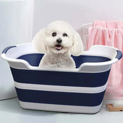 Folding pet bath tub with drainage hole for grooming small dog.
