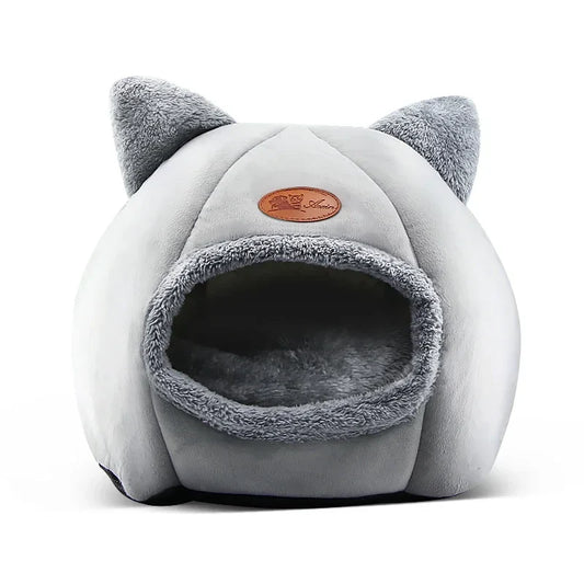 Cozy winter cat bed with plush interior for deep sleep comfort, suitable for cats and small dogs.