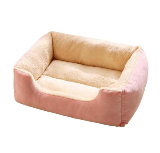 Soft removable square cat bed in pink and beige with plush padding.