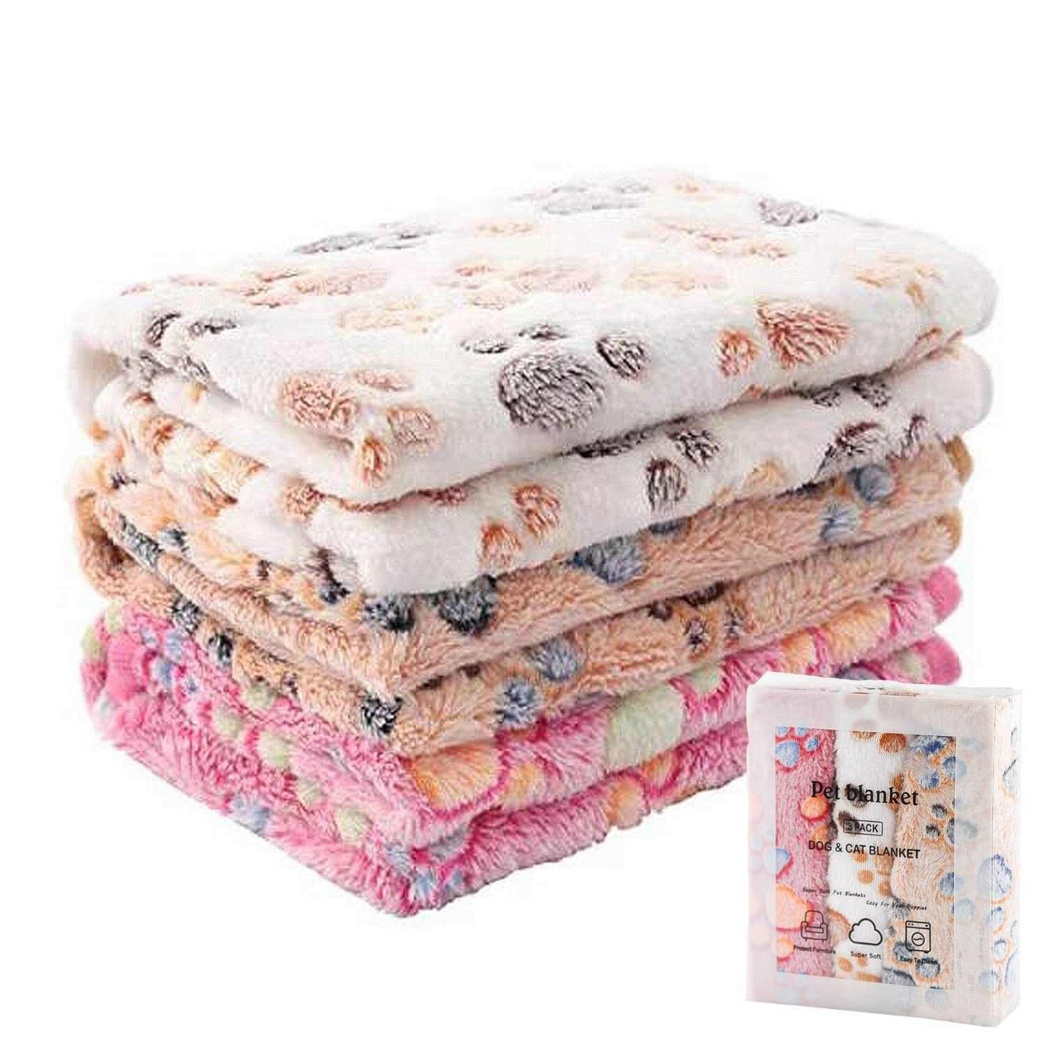 Flannel paw print pet blanket stack, soft no-shed fabric for cats and dogs, machine washable.