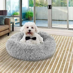 Plush sleeping nest pet bed with a small dog relaxing, ideal for warmth and comfort.