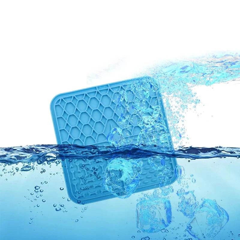 Silicone pet lick mat for dogs with honeycomb design, floating in water, promotes slow feeding and bath time distraction.
