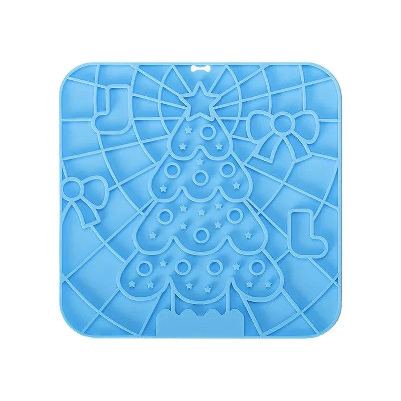 Silicone pet lick mat with Christmas tree design, slow feeder and bath distraction tool for dogs.