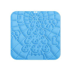 Silicone pet lick mat with Christmas tree design, slow feeder and bath distraction tool for dogs.