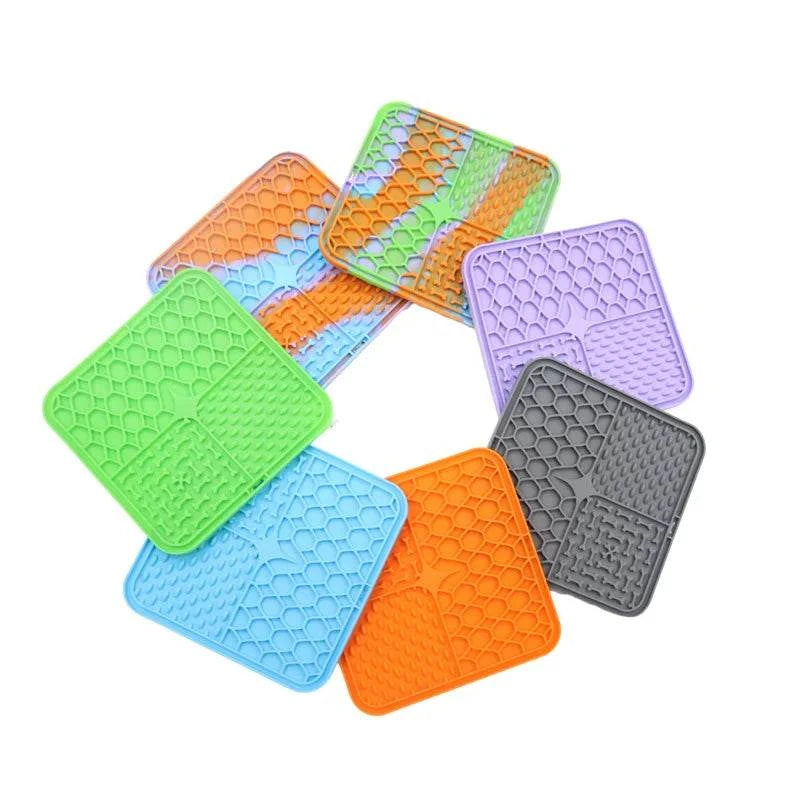 Silicone pet lick mat for dogs, slow feeder and bath distraction tool in various colors.