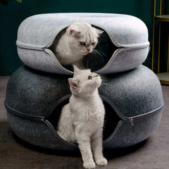 "Donut cat bed with interactive tunnel for playful indoor cats"