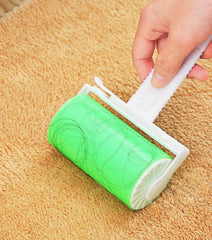 Washable sticky roller removing pet hair from carpet.