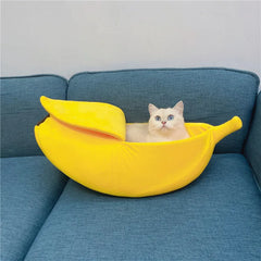 Banana-shaped cozy pet bedding for cats and small dogs, featuring a playful design and soft materials.