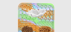 Silicone pet lick mat with diverse textures for slow feeding and bath distraction.
