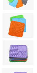 Silicone pet lick mat for dogs in various colors, used as a slow feeder and bath distraction tool with strong suction grip.