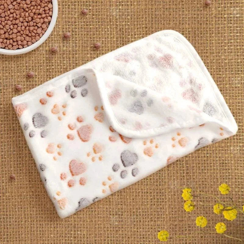 Flannel paw print pet blanket, soft and warm for cats and dogs, no-shed design.