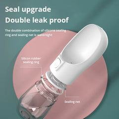 Portable pet travel water bottle with double leak-proof design for outdoor use.