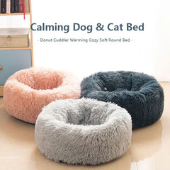 "Round plush pet bed in soft fabric, ideal for keeping pets warm in winter"machine washable dog beds