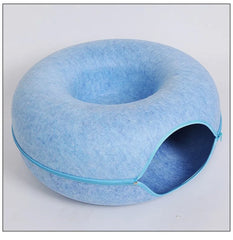 "Donut cat bed with interactive tunnel for playful indoor cats"