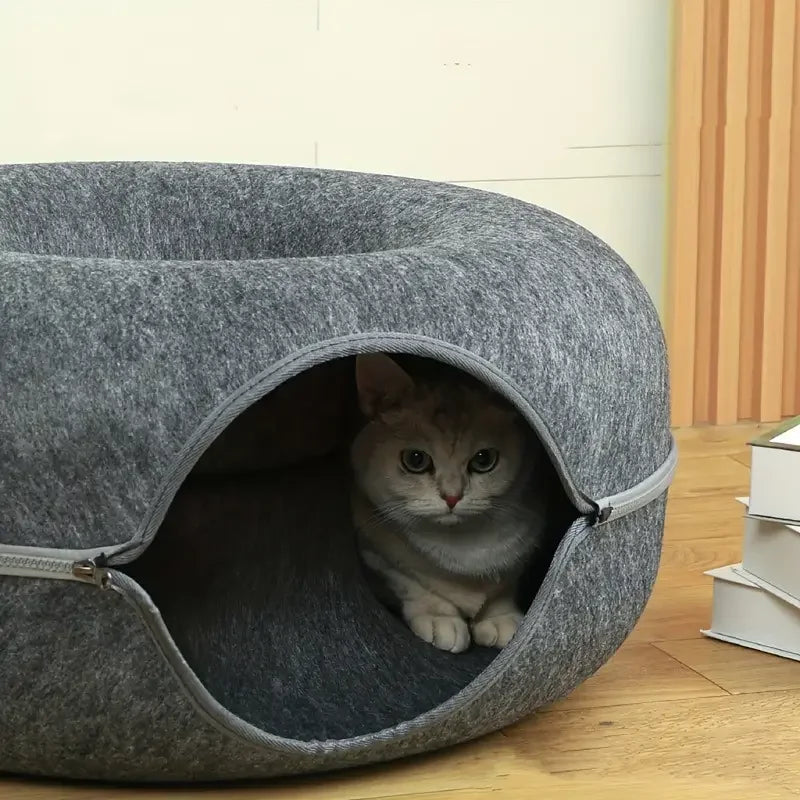 Round cat bed with soft plush cushion, non-slip base, and a cozy design for cats and small dogs.