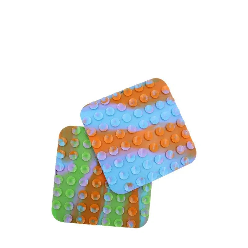 Silicone pet lick mat for dogs, slow feeder, bath distraction tool, colorful design.