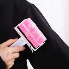 Washable sticky roller removing pet hair from clothing.