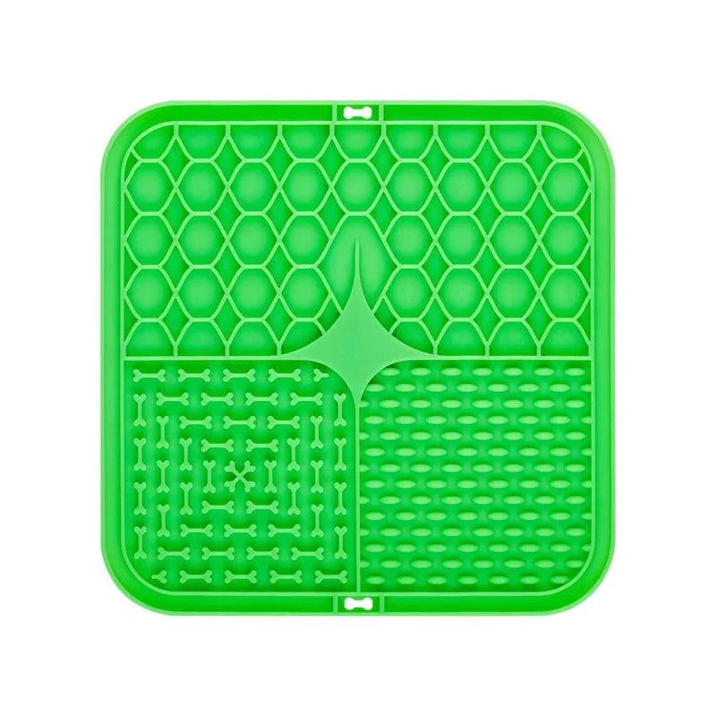Green silicone pet lick mat with textured surface, designed as a slow feeder and bath distraction tool for dogs.