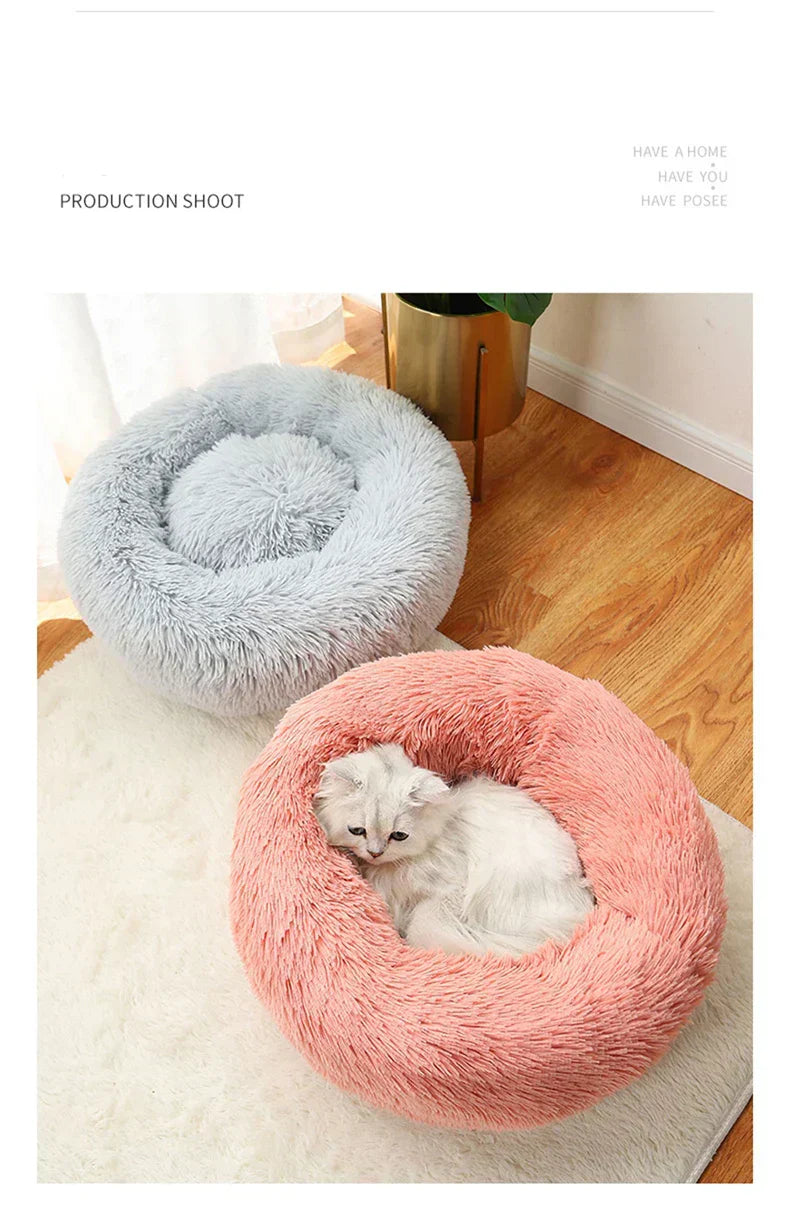 "Round plush pet bed in soft fabric, ideal for keeping pets warm in winter"machine washable dog beds