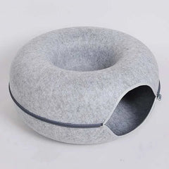 "Donut cat bed with interactive tunnel for playful indoor cats"
