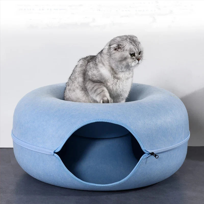 Round cat bed house with soft plush cushion, suitable for small pets, featuring a raised edge for added comfort.