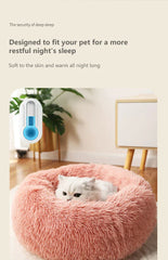 "Round plush pet bed in soft fabric, ideal for keeping pets warm in winter"machine washable dog beds