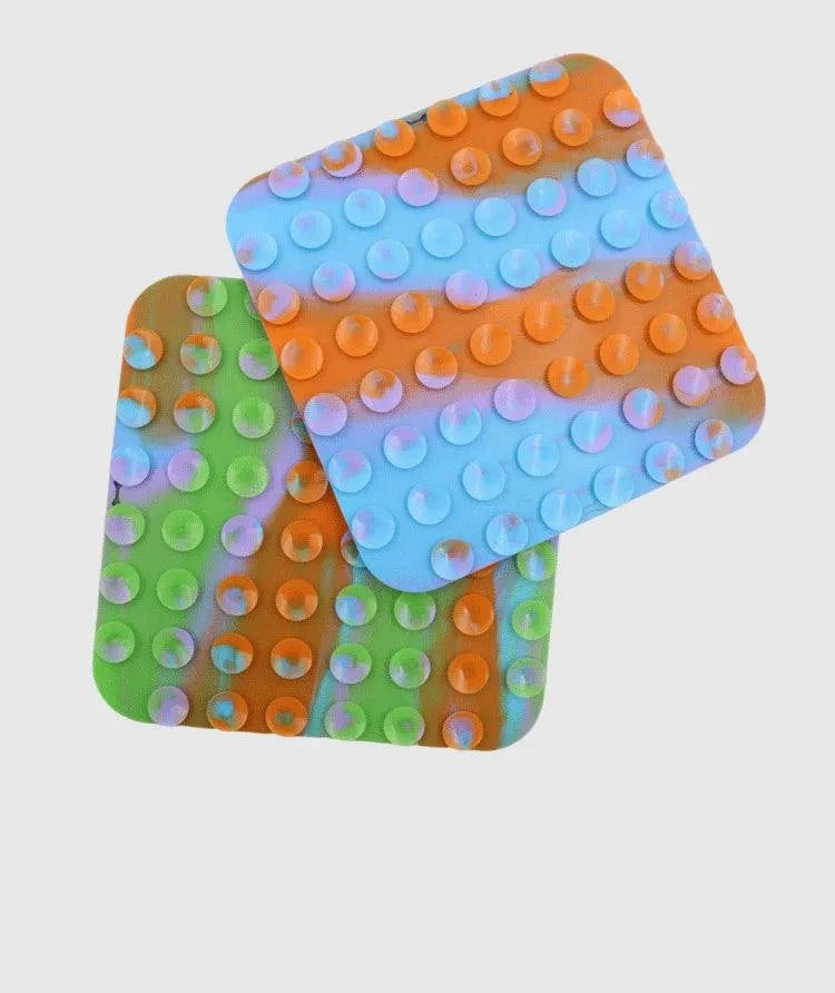 Silicone pet lick mat for dogs, slow feeder and bath distraction tool in colorful design.