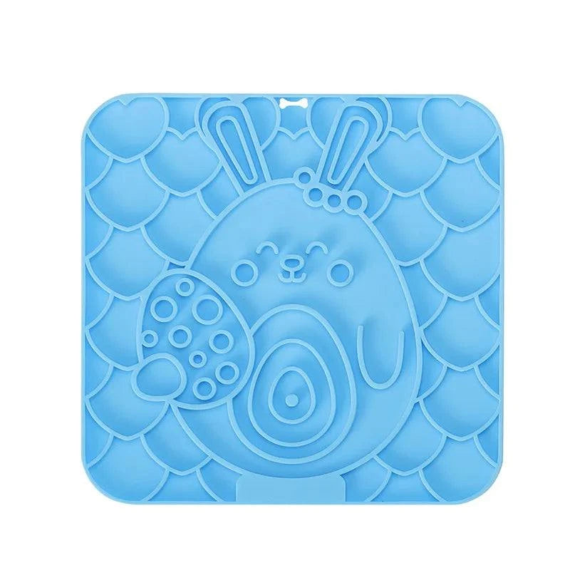 Silicone pet lick mat for dogs, slow feeder, bath distraction tool, blue, with strong suction and calming design.