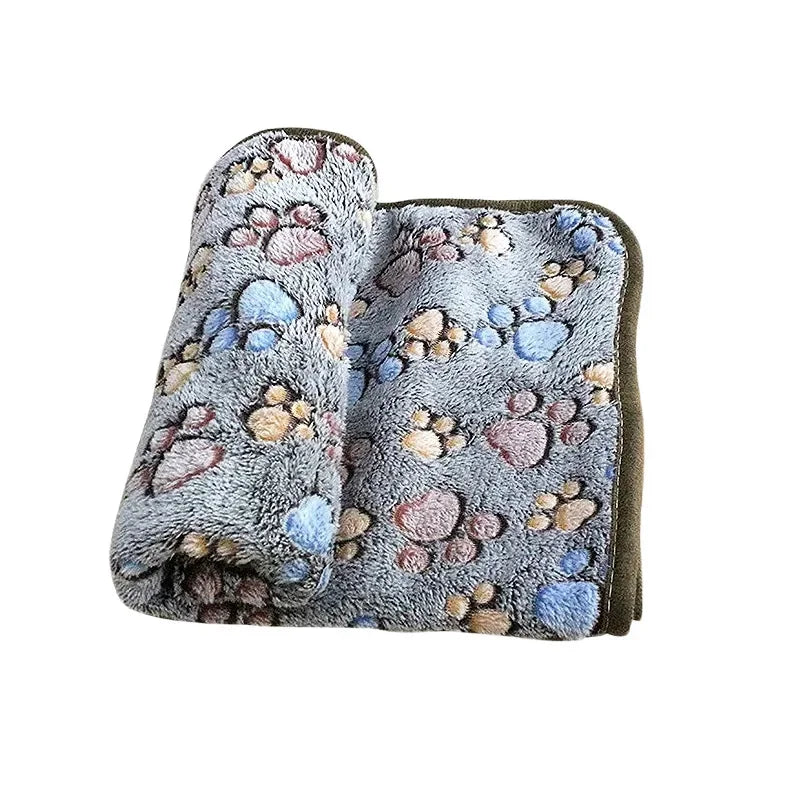 Soft fluffy cartoon pet blanket with paw print design for cats and dogs.
