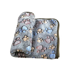 Soft fluffy cartoon pet blanket with paw print design for cats and dogs.
