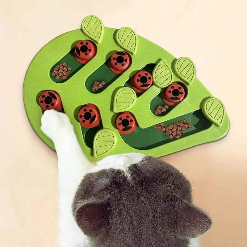 Green leaf shaped cat slow feeder puzzle toy for interactive play and mental stimulation.