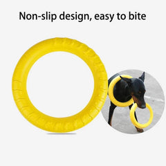 Anti-bite pet flying disk training ring puller for interactive dog play.