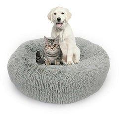 "Round plush pet bed in soft fabric, ideal for keeping pets warm in winter"machine washable dog beds